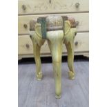 An Indian painted hardwood stand in the form of three elephants, the supports as trunks, 55cm tall