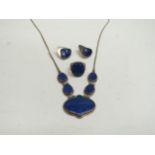 A lapis lazuli necklace, similar earrings and ring