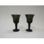 A pair of moss jade wine glasses, 10cm tall