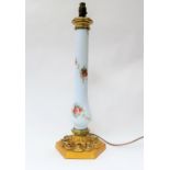 A late 19th/early 20th Century highly ornate lamp base with painted opaque column, ormolu base, 60cm