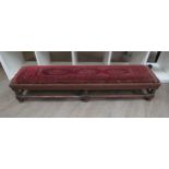 A Georgian footstool with hand-knotted rug upholstery, 22cm high x 122cm long x 30cm wide