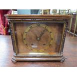 A circa 1930's walnut mantel clock with Roman numeral chapter ring, two train movement with