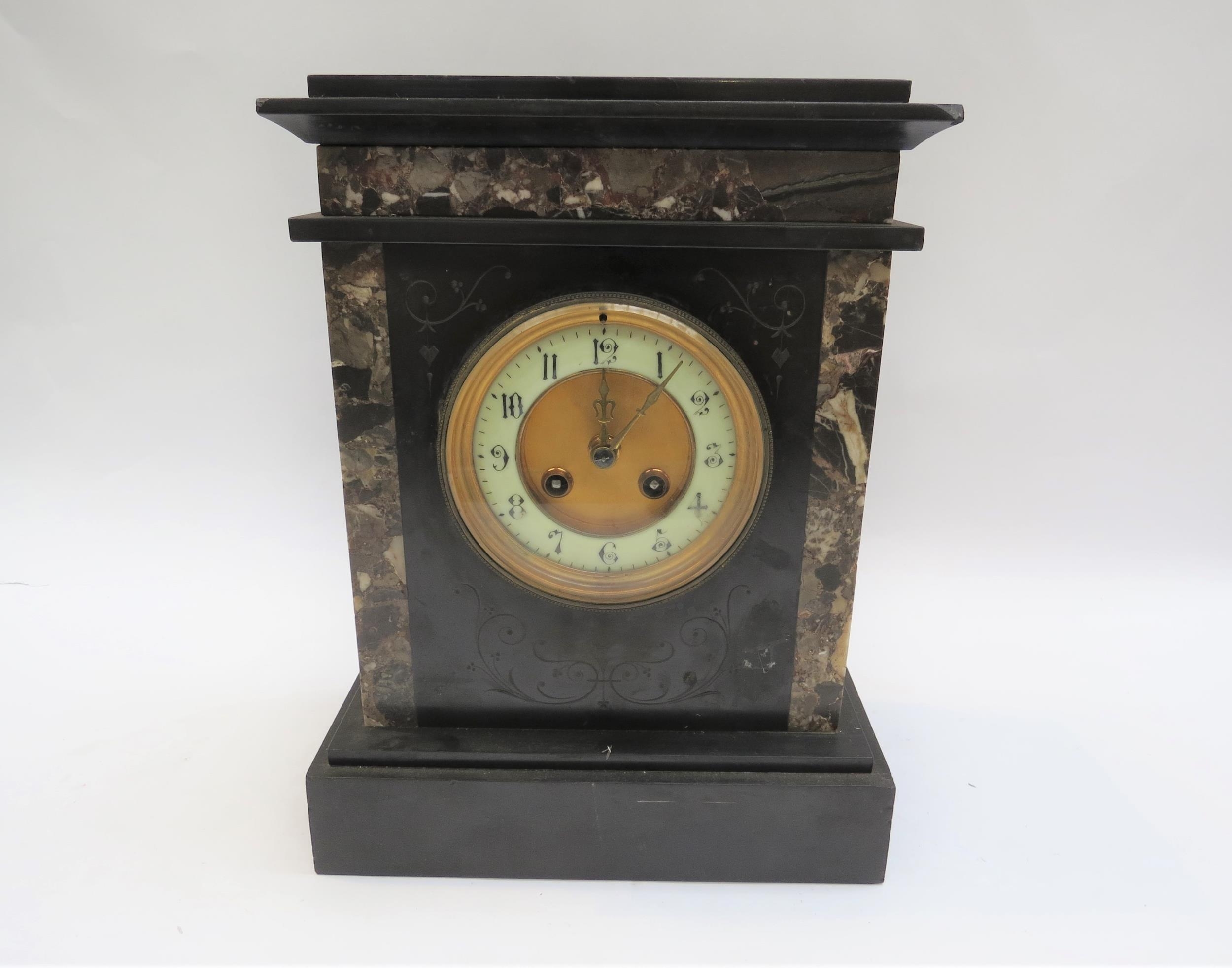 A twin train slate and marble mantel clock numerated chaptering with key, 32cm tall