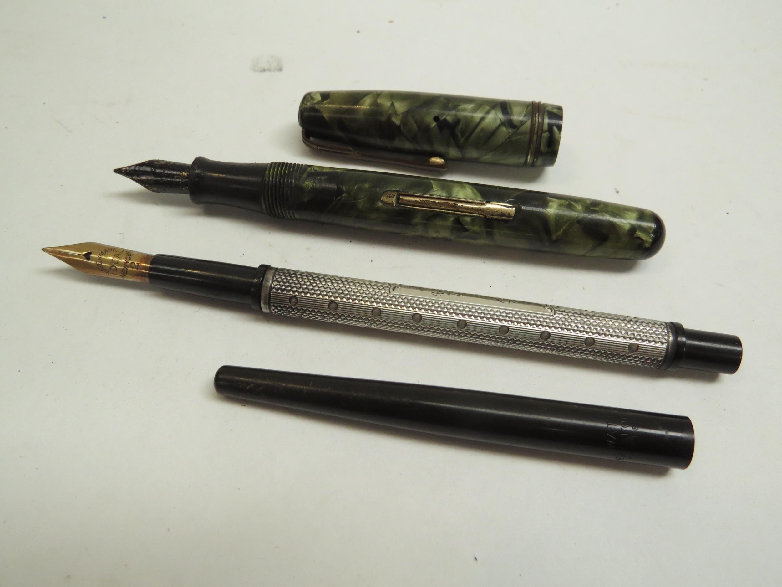An early Watermans ebonite and silver cased Ideal fountain pen. The nib marked Watermans Ideal New - Image 2 of 2