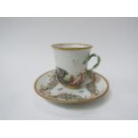 A 19th Century Capo di Monte teacup and saucer, moulded and hand painted in the Classical taste