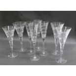 A suite of crystal glass, two wine glasses 26cm tall, two 24cm tall and four matching champagne