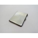 A Turner & Simpson silver and guilloche cigarette case, Birmingham 1963, 8.5cm long x 6.7cm wide x