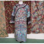A Chinese late 19th/early 20th Century silk robe, colourful bold pattern of stylised dragons and
