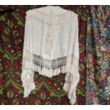 Early 20th Century cream silk shawl, exquisitely hand embroidered with flowers, corded tassel detail