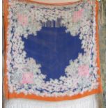 A Chinese blue silk shawl, tangerine border, "Chrysanthemum" design with a toning deep fringing,