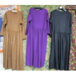 Three fine wool dresses with a drop waist, black herringbone and purple diagonal stripe and plain