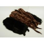Two vintage ferret fur stoles, a black fur stole and shaggy lambs wool collar