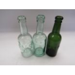 Three 1/2 pint glass bottles, stamped with company initials - LNER, LMS and NER