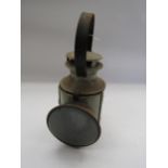 An LMS three aspect handlamp with reservoir, burner and reflector plate. Stamped LMS to side and