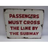 An enamel station sign - "Passengers must cross the line by the subway" some chips to the enamel