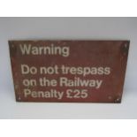 A cast alloy sign - Warning Do Not Trespass