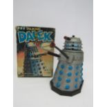 A boxed 1975 Palitoy Dr Who Talking Dalek battery operated silver plastic Dalek action figure,