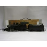 A Bachmann G scale Baldwin Locomotive Works 2-8-0 locomotive and tender, housed in a bespoke