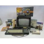 An Amstrad CPC 6128 128K Colur Personal Computer with CTM 644 monitor, games and software