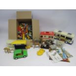 A collection of mixed loose Playmobil figures, vehicles and accessories including ambulance, bus