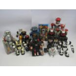 A collection of plastic toy robots, mostly battery powered, including Beat-Magnum (boxed), Magic