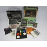 A boxed Sinclair ZX Spectrum Personal Computer with various games and software, custom keypanel kit,