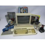 A Commodore Amiga A1200 vintage home computer system with 1085S monitor, assorted games and