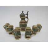 A miniature stoneware jug and set of six matching cups, after Doulton's copy of the 12th Century