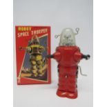 A modern boxed tinplate Robot Space Trooper with crank-handle friction motor