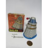 A boxed CODEG 1965 Doctor Who Dalek Money Box in silver, blue and gold, accessories damaged