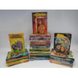 A collection of annuals including 2000AD, Transformers, Buck Rogers, Action Force, Thundercats,