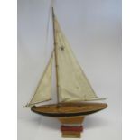 A vintage Star Yacht 'Meteorite' wooden pond yacht with cloth sails and weighted keel, 77cm tall x