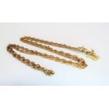 A gold necklace, unmarked hung with a Chinese symbol, 62cm long, 9.2g