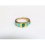 A gold ring set with five cabochon blue and green turquoise stones, unmarked. Size N, 4.1g