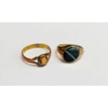 A gold signet ring, unmarked re-sized with a black banded agate. Size O, 5.3g and an unmarked gold