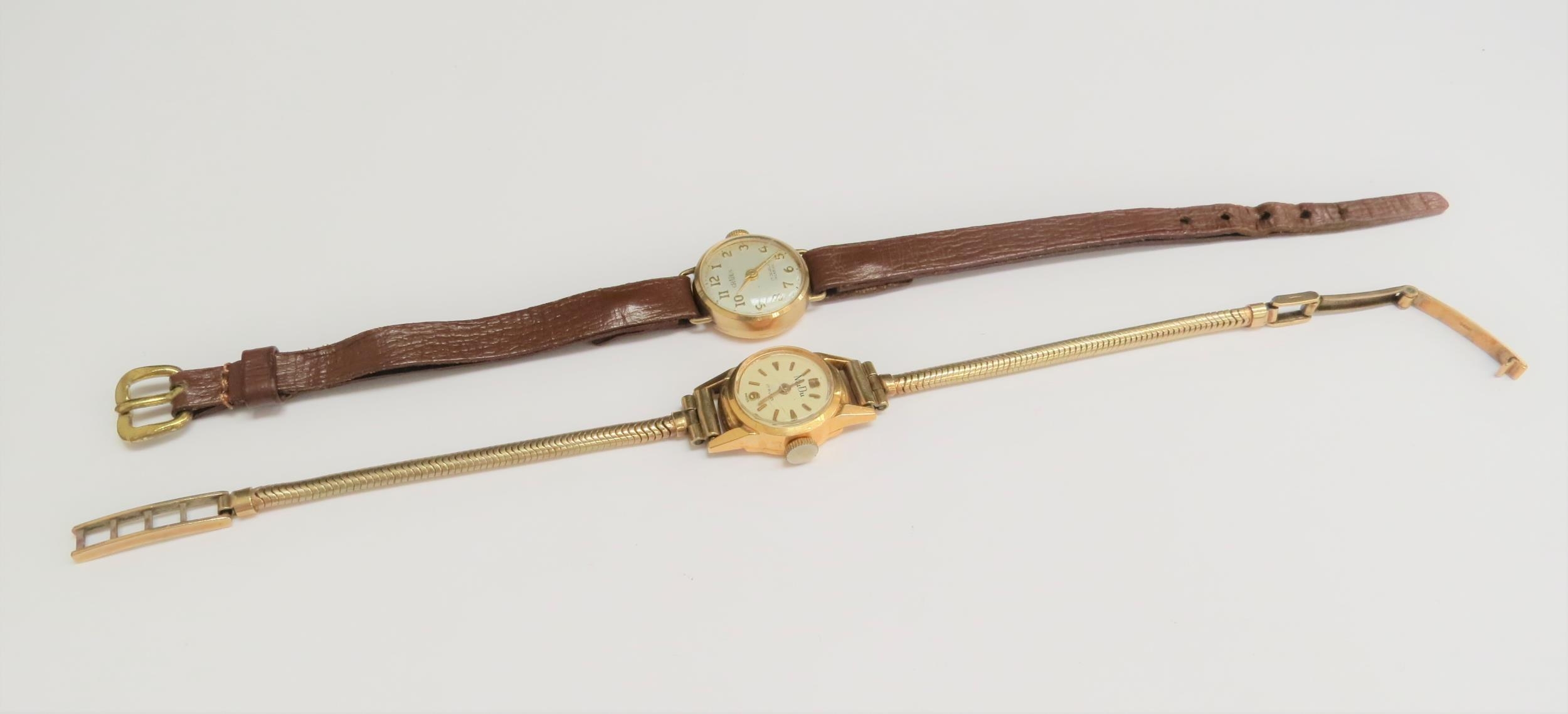 A MuDu 18ct gold cased lady's wristwatch on a 9ct gold strap, 12.3g and a 9ct gold cased Gradus