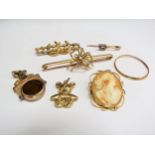 A 9ct gold spider bar brooch, double horseshoe bar brooch, teddy bear charm 13.8g, a diamond set