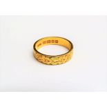 A 22ct gold wedding band, floral detail. Size P, 5.2g