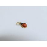 An enamel charm as a ladybird, 6mm long, marks indistinct, 0.4g