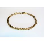 A 9ct gold bracelet with box form pierced links, 21cm long, 8.8g