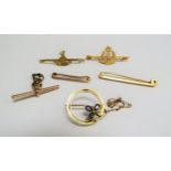Three 9ct gold bar brooches, 9ct gold T-bar and two 15ct gold brooches, 13.9g total