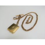 A 9ct gold watch chain with T-bar, 41cm long, 32g hung with a 15ct gold picture locket set with a