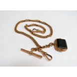 A 9ct gold watch chain hung with T-bar, 40cm long, 40g with a swivel fob 6.3g