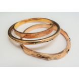 Three gold bangles, all a/f, one marked 9ct, 36.6g