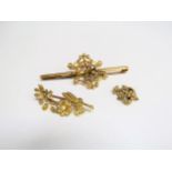 Two gold seed pearl brooches of floral form, one marked 9ct and a similar item, 17.5g