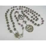 An ornate Rosary, silver bead and amethyst hung with medals, Angels, Lamb of God and Crucifix (