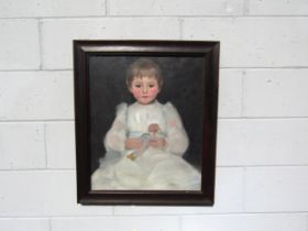 An oak framed and glazed oil on canvas portrait study of a young girl holding a doll. Indistinctly