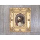 A late 19th Century hand painted porcelain oval panel depicting Christ, probably by KPM. Set in an