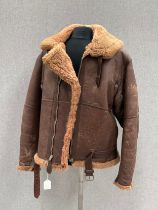 A WWII British Irvin sheepskin flying jacket, size 4, latch repairs present