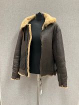 A WWII B3 sheepskin flying jacket by Perry Sportswear Co., with artwork to back, some wear requiring